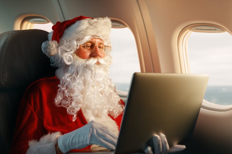 Babbo Natale al pc sull'aereo